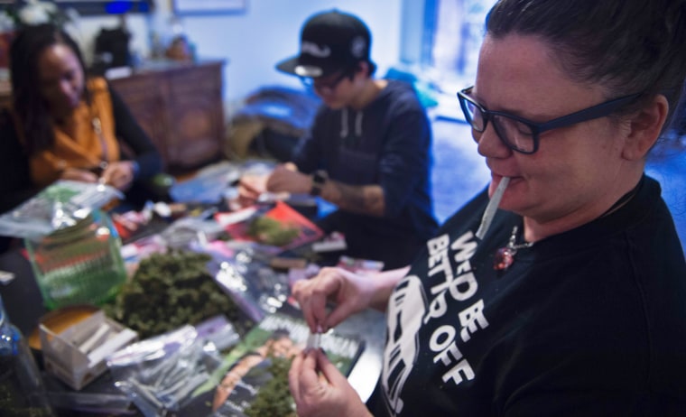 Image: Members of the DC Marijuana Coalition that plan on handing out approx 4,200 joints of legally grown cannabis on Jan. 20 roll joints on Jan. 5 inside their home in Washington, D.C.