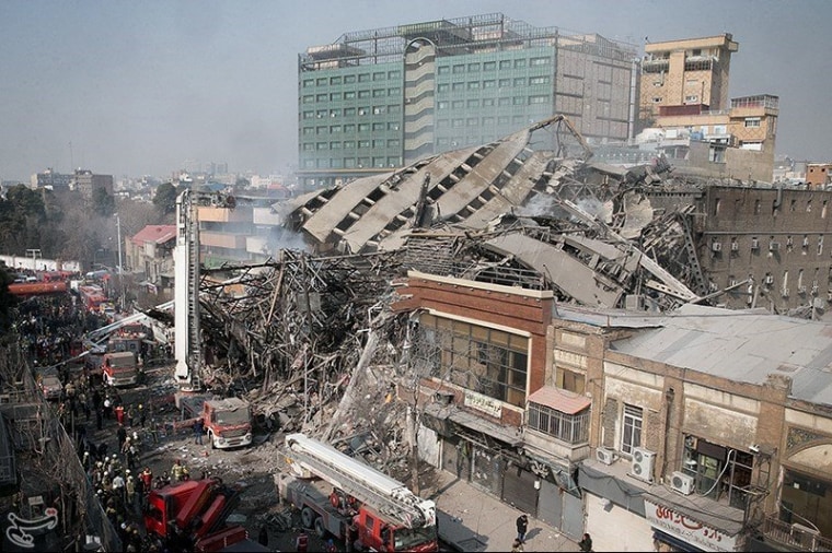 Image: A collapsed building is seen in Tehran