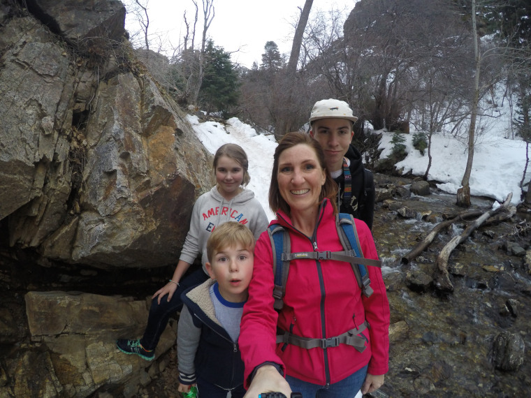 Ginger Johnson, 41, takes a family selfie on a hike with her three children in Adams Canyon in the Wasatch Mountains, Utah. Johnson, who is battling cancer, recorded videos to the SafeBeyond platform that her children will receive at a specified time after she dies.