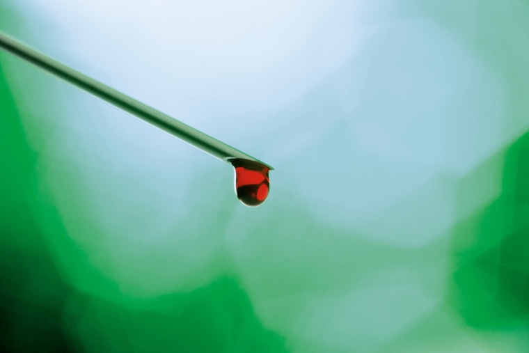Image: A drop of blood drips off a needle