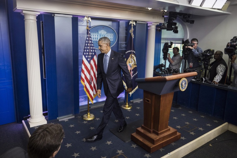 Image: Obama departs the Brady Press Briefing Room after his last press conference