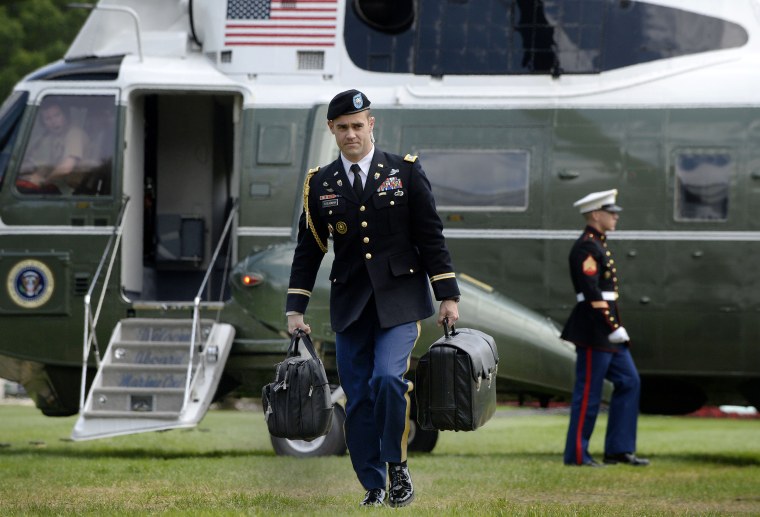 Image: A military aide carries the president's nuclear "football"