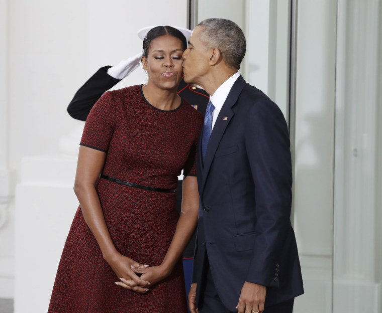 Image: President Barack Obama kisses first lady Michelle Obama
