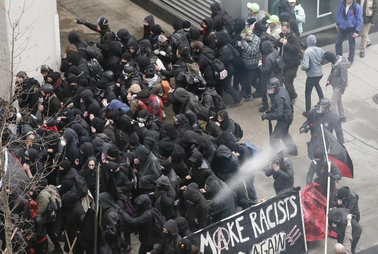 Image: Police use pepper spray on protesters in Washington, Jan. 20, 2017, in a chaotic confrontation blocks from Donald Trump's inauguration as protesters registered their rage against the new president.