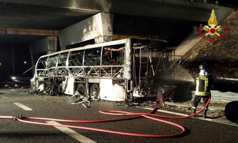 Image: A handout image from Italian firefighters shows the burned Hungarian bus after on the A4 highweay near Verona, Italy.