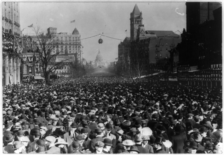 Image: The enormous crowd marched down Pennsylvania Ave., looking toward the Capitol and past old Post Office.