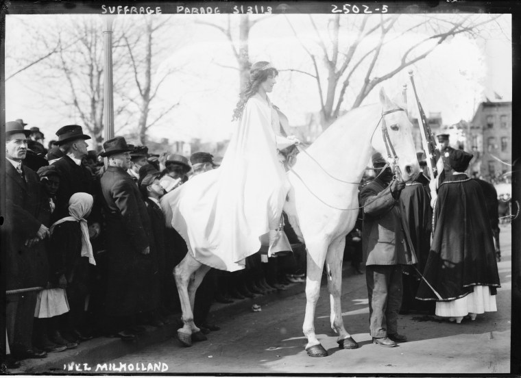 Image: Attorney Inez Milholland Boissevain rides astride the suffrage parade in as the first of four mounted heralds.