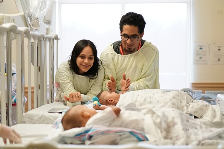 Laurilin and Marino Camacho with Ballenie and Bellenie recovering after surgery at Maria Fareri Hospital.