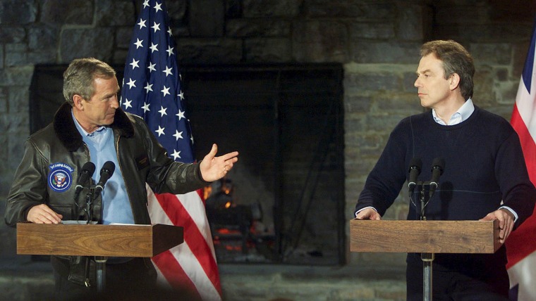 Image: President George W. Bush and British Prime Minister Tony Blair speak at a press conference