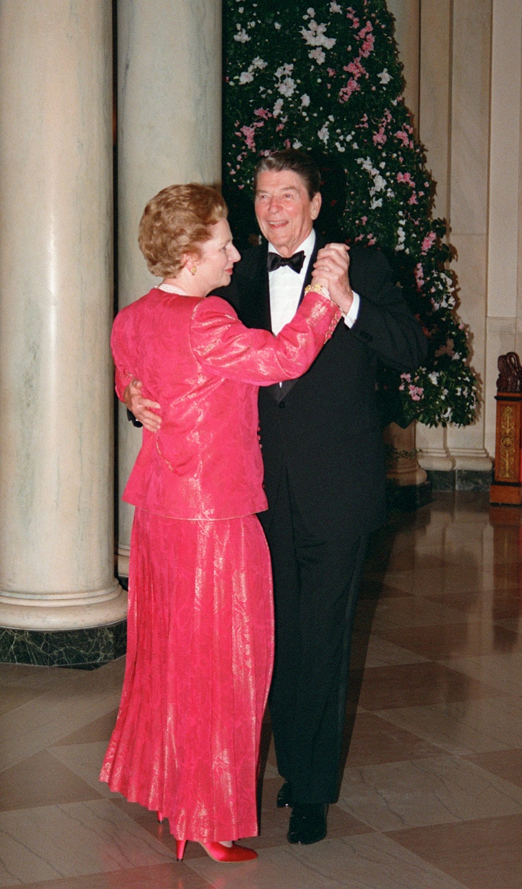 Image: British Prime Minister Margaret Thatcher dances with President Ronald Reagan