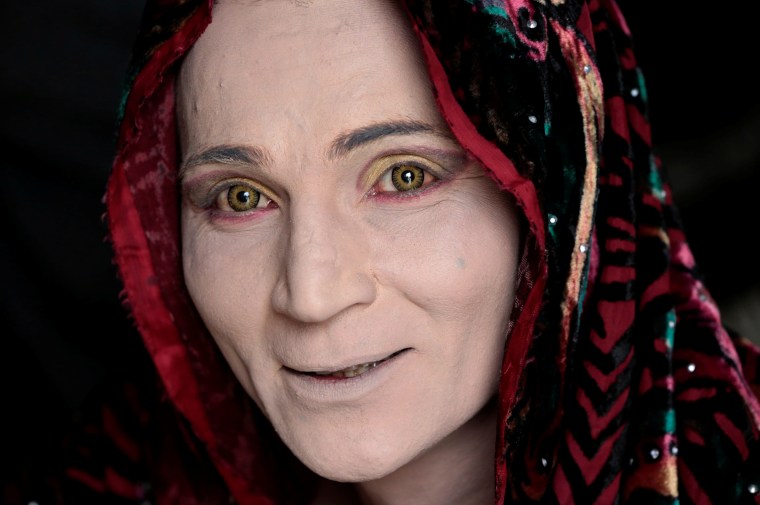 Image: Rani, a member of the transgender community, smiles as she prepares for Shakeela's party in Peshawar