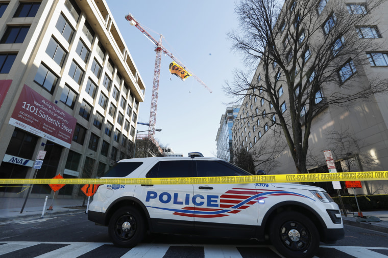 Image: A police car blocks the street near the construction site of the former Washington Post building in Washington, D.C., Jan. 25, 2017.