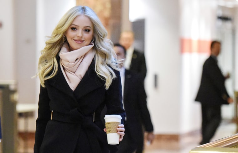 Image: Tiffany Trump passes through the lobby at Trump Tower in New York City
