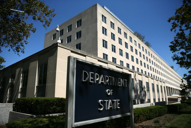 Image: A sign stand outside the U.S. State Department in Washington, D.C.