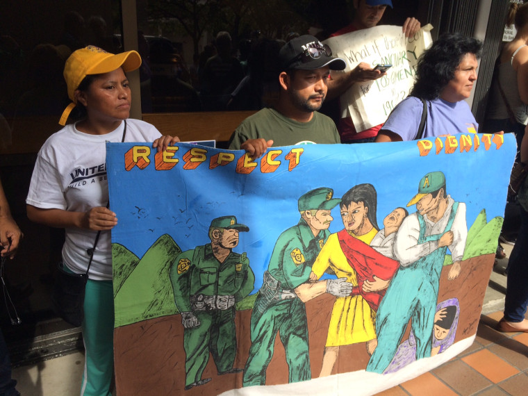 Demonstrators protesting at City Hall and the office of Miami-Dade County Mayor Carlos Gimenez Friday, Jan. 27, 2017. 