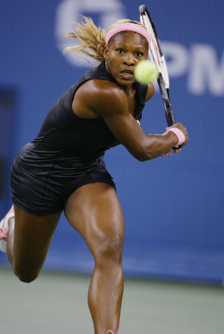 Image: 2002: Serena Williams chases down a ball while playing her sister Venus during the women's final at the U.S. Open in New York on Sept. 7.