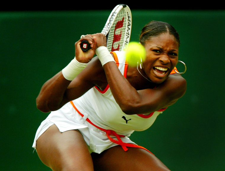 Image: 2003: Serena Williams returns to her sister Venus during their women's singles final match at the Wimbledon Tennis Championships in London on July 5. Serena defeated Venus.
