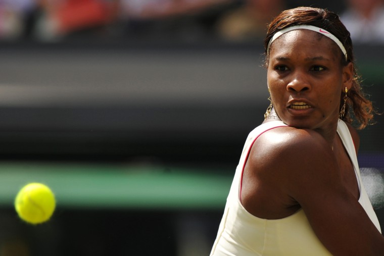 Image: 2010: Serena Williams returns a ball to Russia's Vera Zvonareva in the women's final during the Wimbledon Tennis Championships in London on July 3. Williams defeated Zvonareva to win her fourth Wimbledon title.