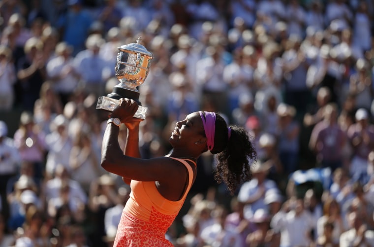 Image: 2015: Serena Williams poses with the trophy during the ceremony after defeating Lucie Safarova of the Czech Republic during their women's singles final match to win the French Open tournament at the Roland Garros stadium in Paris on June 6.