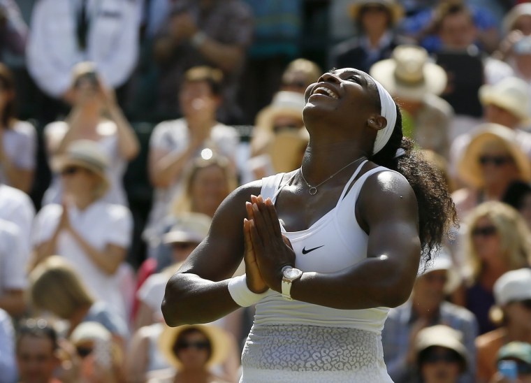 Image: 2015: Serena Williams celebrates winning the singles match against Garbine Muguruza of Spain at the All England Lawn Tennis Championships in Wimbledon, London on July 11.