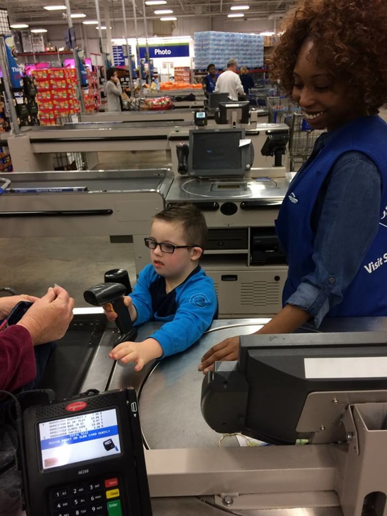 Carter helps out at the cash register