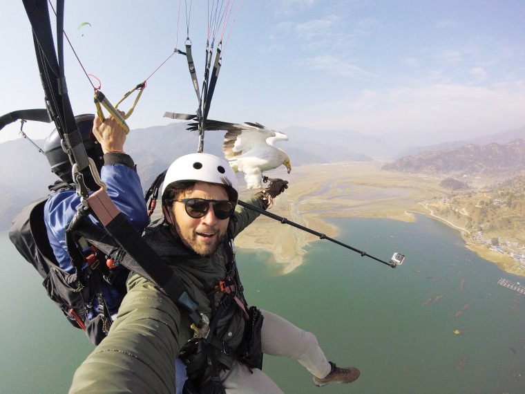Strand went "parahawking" in Pokhara, Nepal, with the help of an organization that combines paragliding with falconry and the conservation of birds of prey.