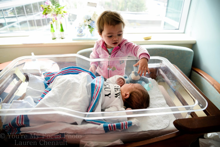 Lauren Chenault, 24, takes pictures of son Kai Arthur during delivery