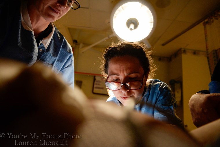 Lauren Chenault, 24, takes pictures of son Kai Arthur during delivery