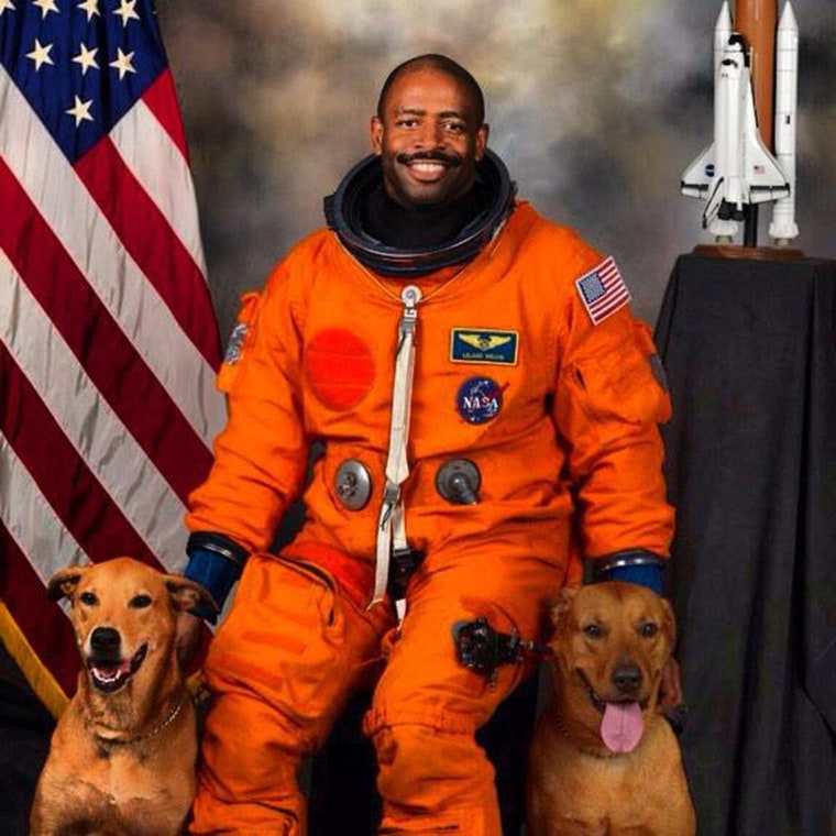 Astronaut Leland Melvin with his rescue dogs Jake and Scout.