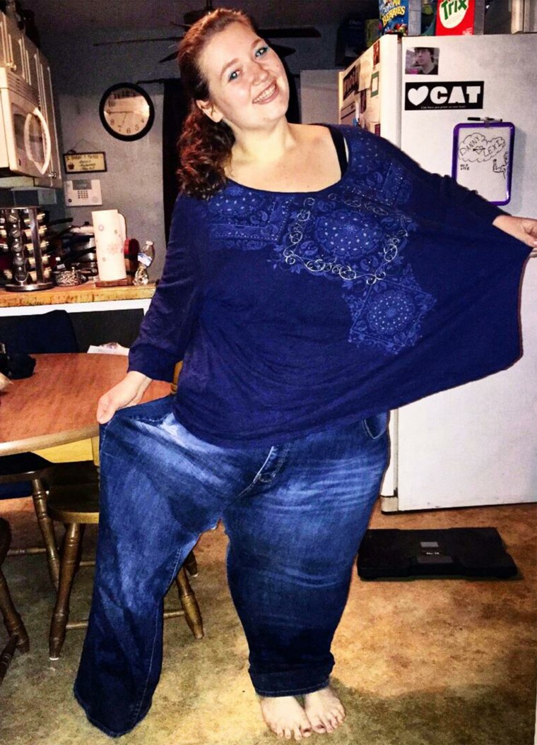 After losing 236 pounds in a year, Lexi Reed can fit into one leg of the jeans she wore when she weighed 485 pounds. She hopes to continue losing and being healthy.