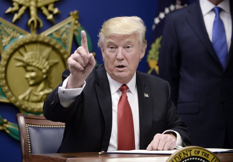 Image: US President Donald Trump signs Executive Orders at the Pentagon in Arlington, Virginia
