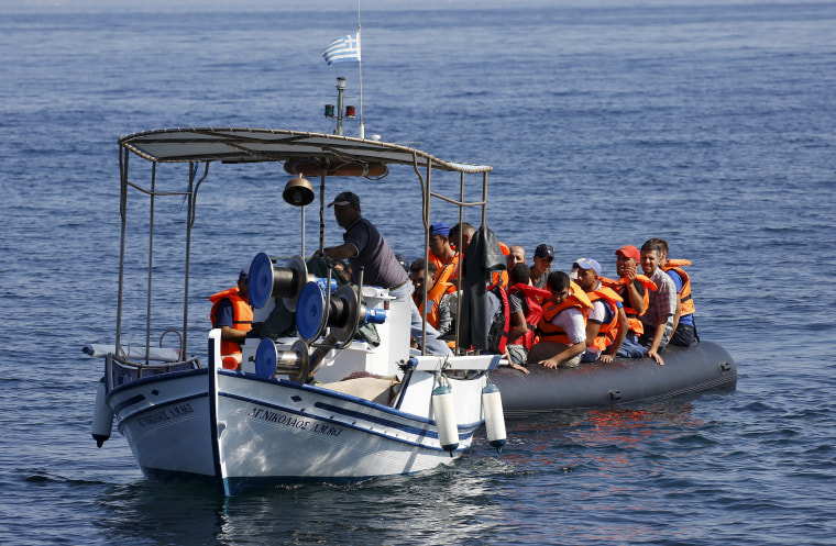 Image: Greek fishermen rescue Syrian Kurdish refugeess