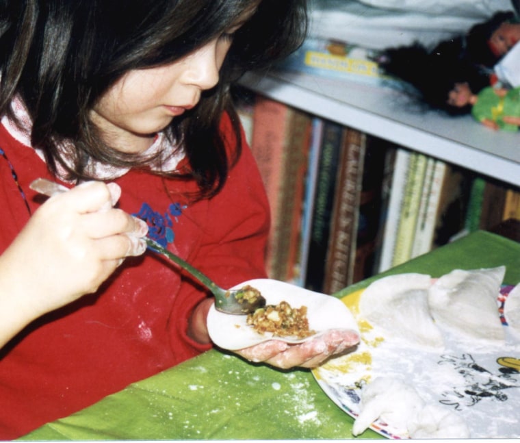 Frances Kai-Hwa Wang's daughter making dumplings for the Chinese New Year.