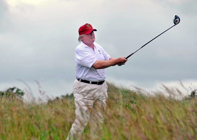 US tycoon Donald Trump plays a stroke as