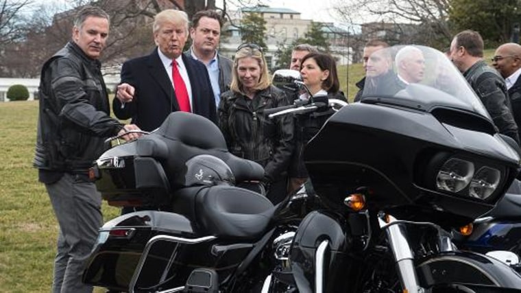 President Donald Trump speaks with Harley-Davidson CEO Matthew Levatich as he arrives to meet with Harley-Davidson executives and union representatives on the South Lawn of the White House in Washington, DC, on February 2, 2017.