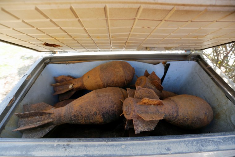 Image: Mortar shells left behind by Islamic State militants are seen at Nour Park at Mosul's zoo