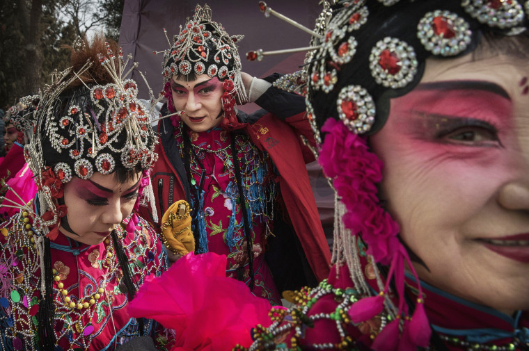 Image: Chinese dancers wear costumes after performing at a fair on the second day of the Chinese Lunar New Year on Jan. 29 in Beijing, China.