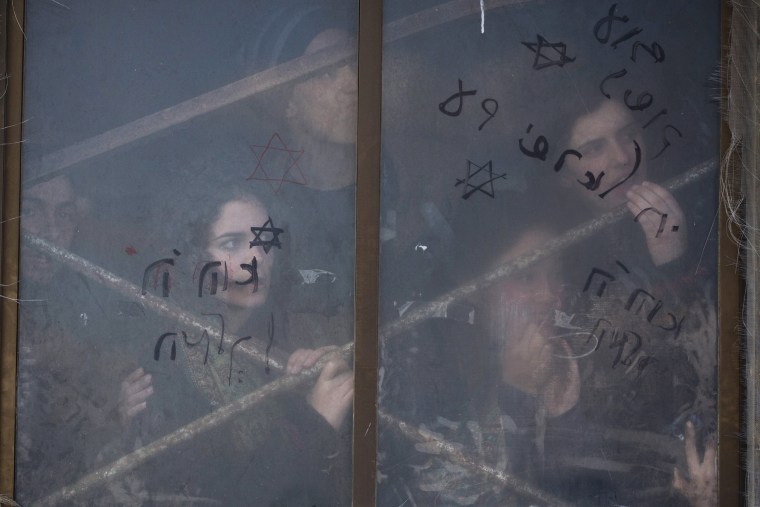 Image: Israeli settlers barricade themselves in their house as Israeli security forces arrive to the illegal Jewish settlement of Amona, in the West Bank, on Feb. 1.