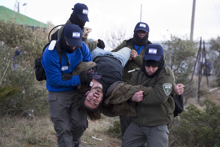 Image: Israeli police arrest a settler in Amona outpost in the West Bank, on Feb. 1.