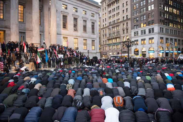 Image: People gather for evening prayer at a rally at Brooklyn's Borough Hall as Yemeni bodega and grocery-stores shut down to protest President Trump's executive order banning immigrants and refugees from seven Muslim-majority countries, including Yemen,
