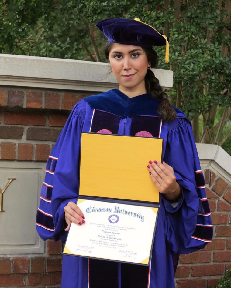 Image: Nazanin Zinouri poses for a photo with her PhD degree from Clemson University in Clemson, South Carolina.