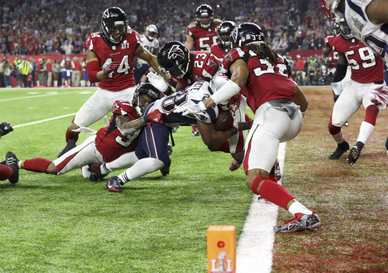 Image: New England Patriots' James White scores a touchdown during overtime to win the Super Bowl LI against the Atlanta Falcons in Houston