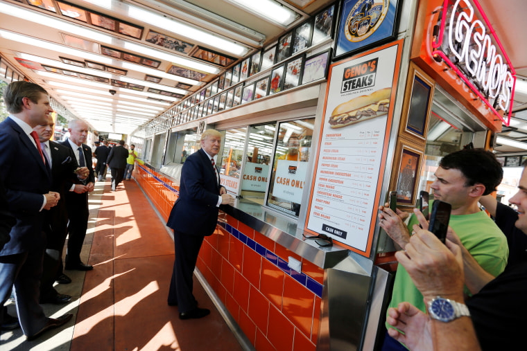 Republican presidential nominee Trump waits for his order on a stop at Geno's Steaks cheesesteak restaurant in Philadelphia
