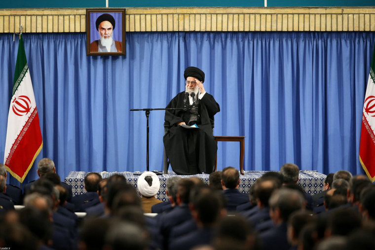 Image: Ayatollah Ali Khamenei waves as he delivers his speech Tuesday.