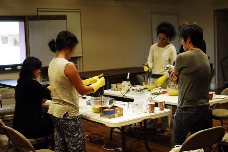 Kathryn Xian, far right, teaching women how to make soaps during a workshop.