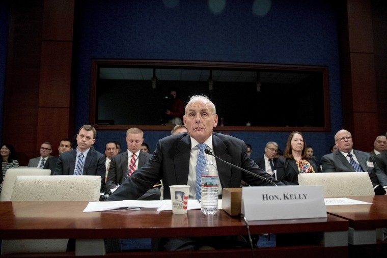 Image: John Kelly  listens to a question while testifying on Capitol Hill