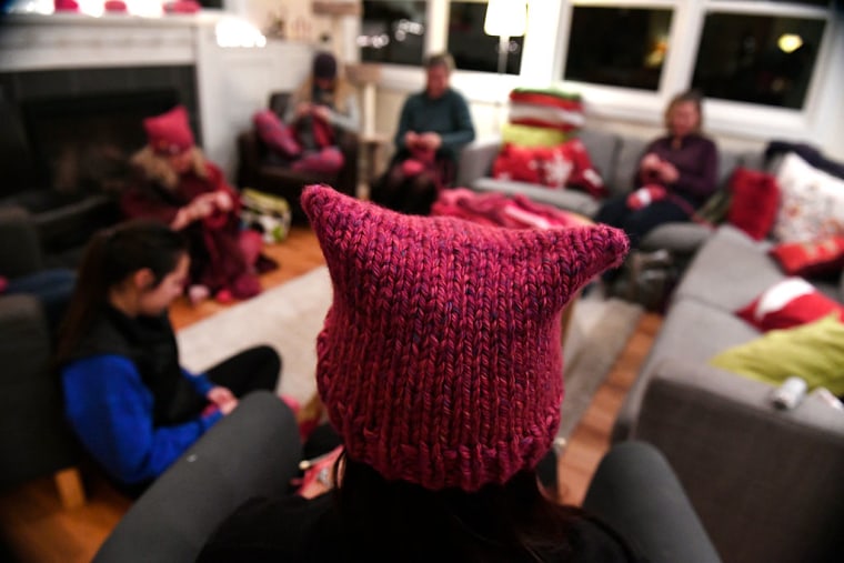 Members of the Pussyhat Project knit dozens of pink hats for people to wear in Washington DC during the inauguration of Donald Trump in Lafayette, Colorado.