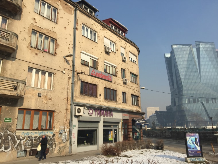 Image: Bullet holes and shelling damage still scar a building in Sarajevo 