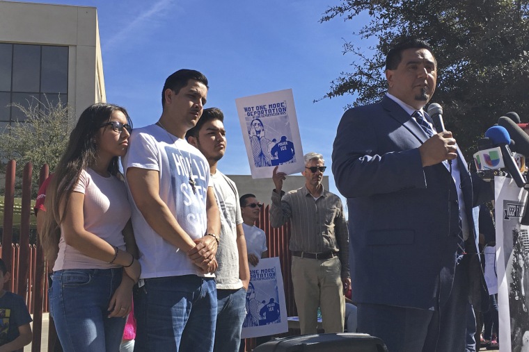 Image: The family of Guadalupe Garcia de Rayos stands behind her attorney, Ray Ybarra Maldonado, as he speaks in front of the U.S. Immigration and Customs Enforcement office in Phoenix on Feb. 9, 2017.