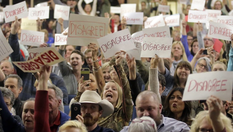 Image: Crowd reacts to Rep. Jason Chaffetz as he speaks during a town hall in Cottonwood Heights, Utah.